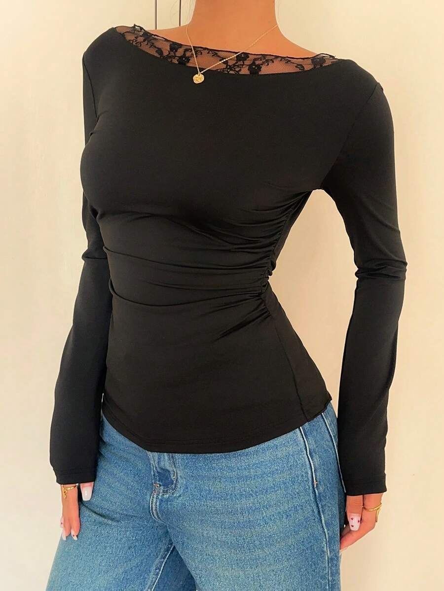 Women's black long sleeve boat neck T-shirt featuring contrast lace patchwork detail and a slim fit.