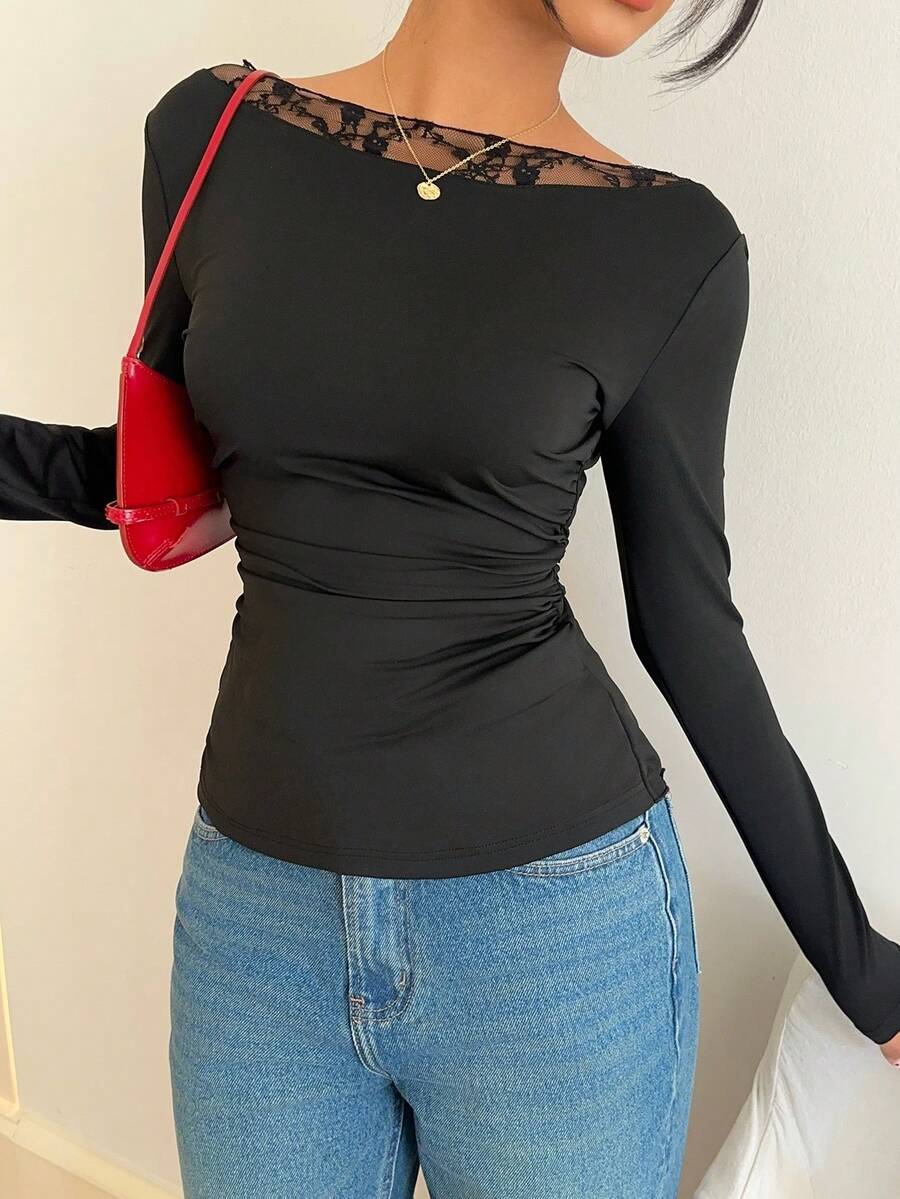 Women's black long sleeve boat neck T-shirt featuring contrast lace patchwork detail and a slim fit.