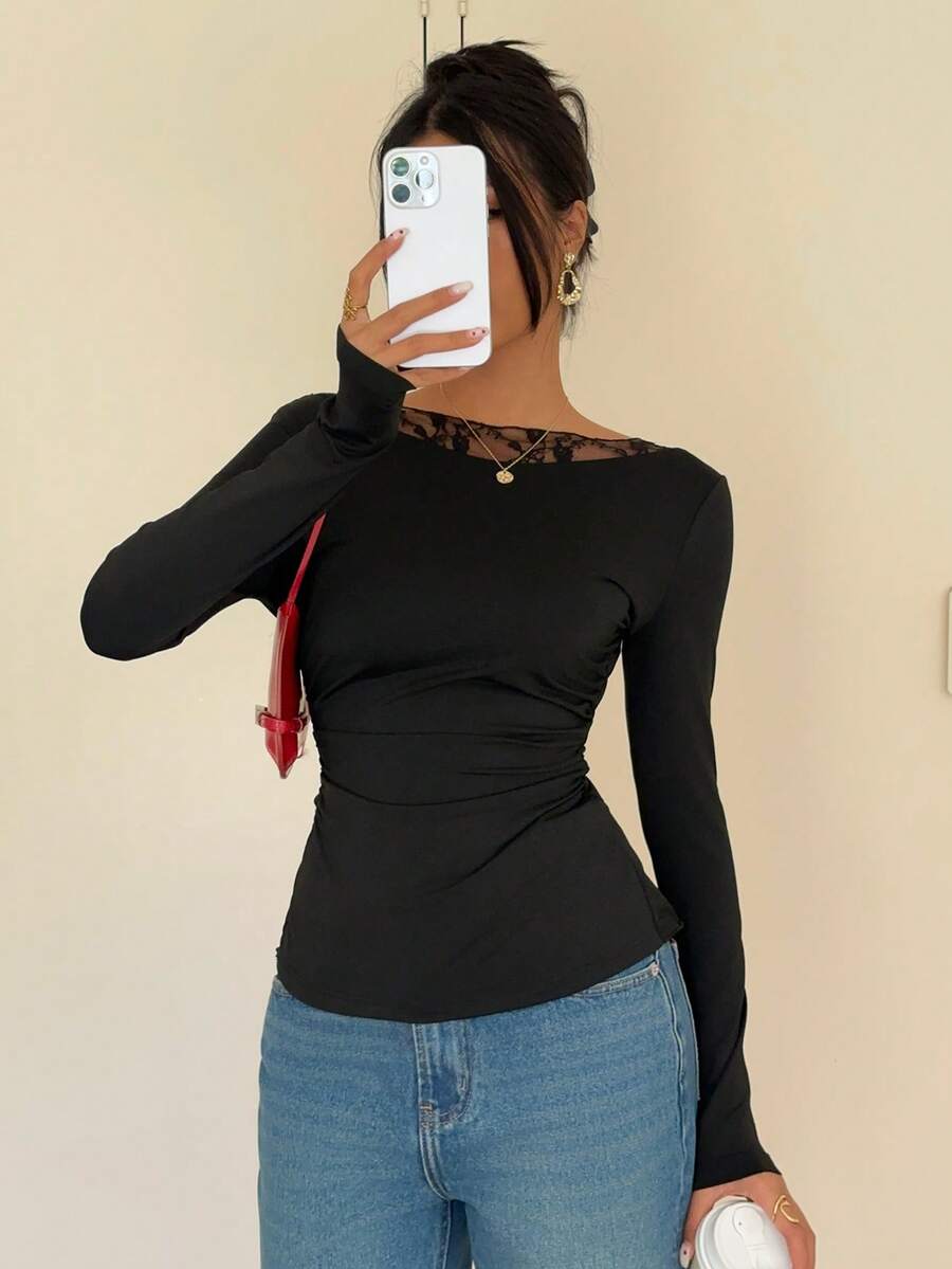 Women's black long sleeve boat neck T-shirt featuring contrast lace patchwork detail and a slim fit.