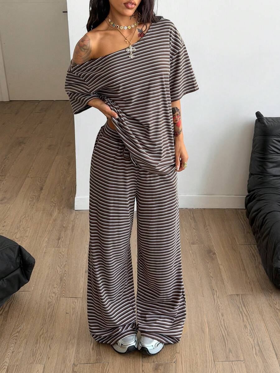 Women's two-piece outfit featuring an oversized asymmetrical neck t-shirt and matching wide-leg drawstring sweatpants.
