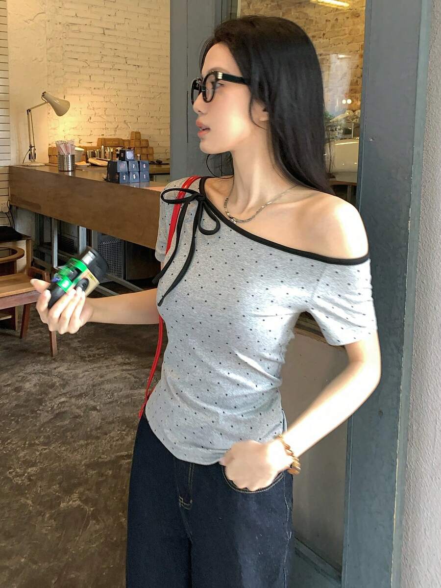 Women's casual short sleeve t-shirt with an asymmetrical neck in a loose fit knitted fabric.