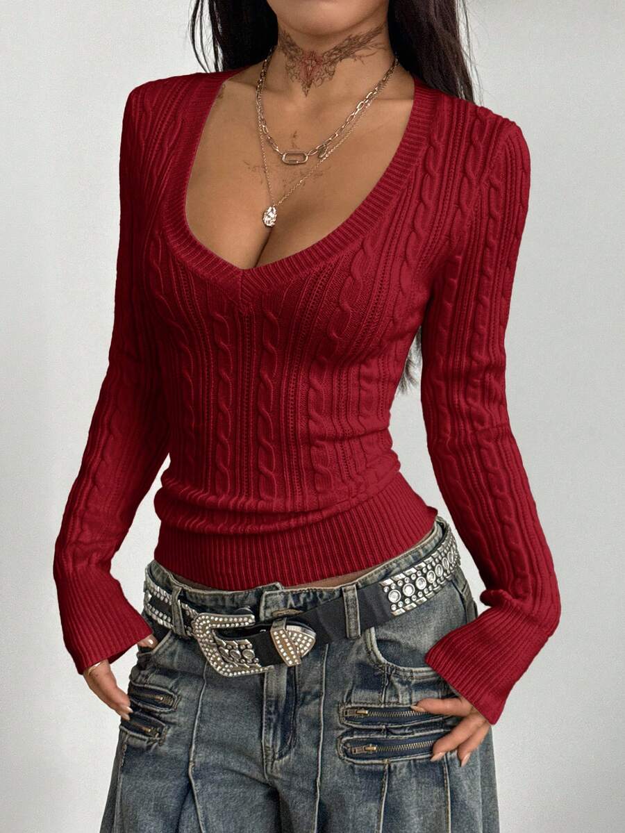 Women's slim fit cable-knit sweater with a V-neckline and long sleeves in solid green rib knit fabric.