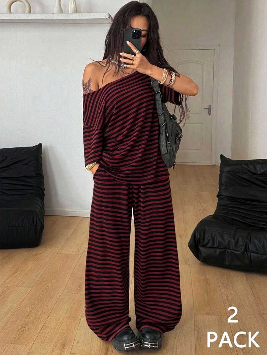 Women's two-piece outfit featuring an oversized asymmetrical neck t-shirt and matching wide-leg drawstring sweatpants.