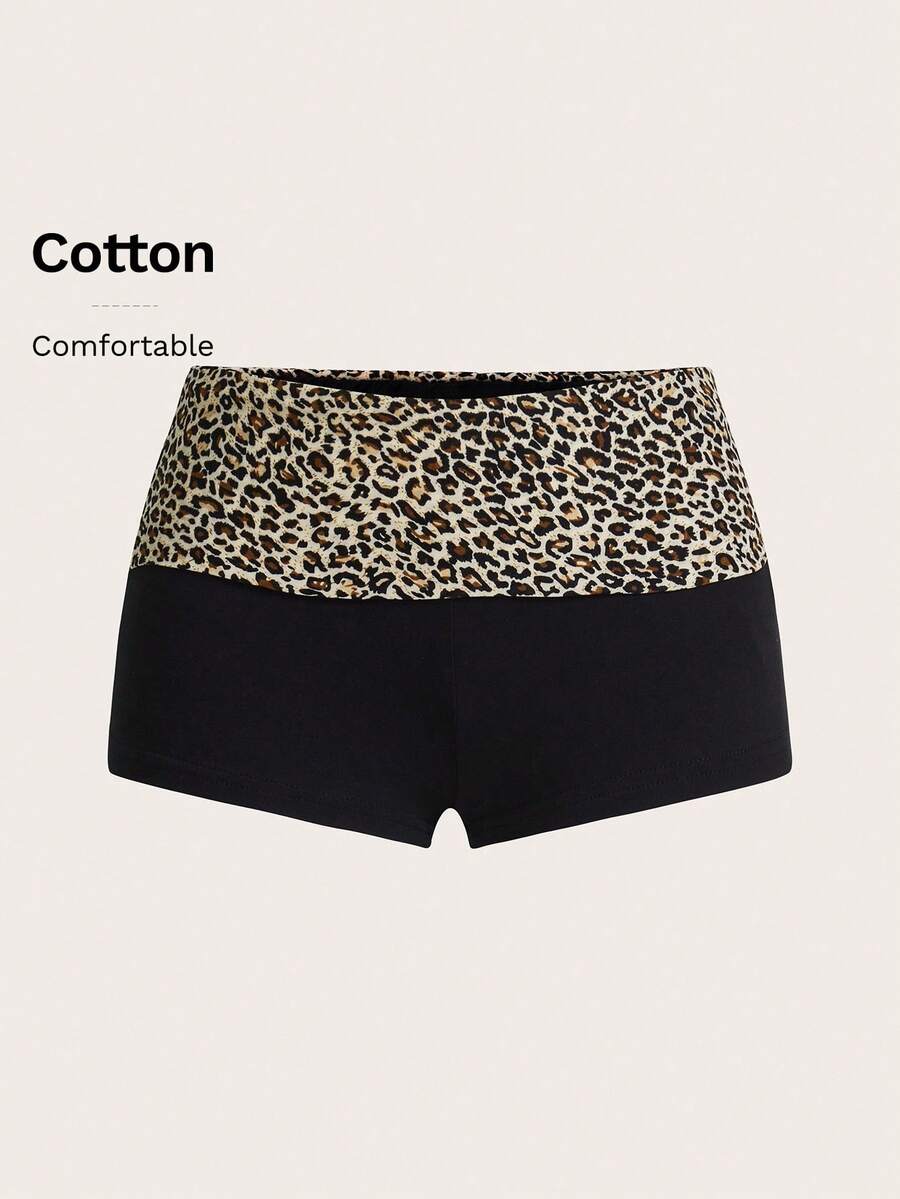 Leopard print foldover waist ultra low rise mini shorts with elastic waistband, skinny fit, and short length.