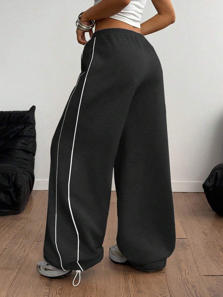 Women's wide leg trousers with a tree branch graphic pattern, loose fit, and mid-rise waist in woven fabric.