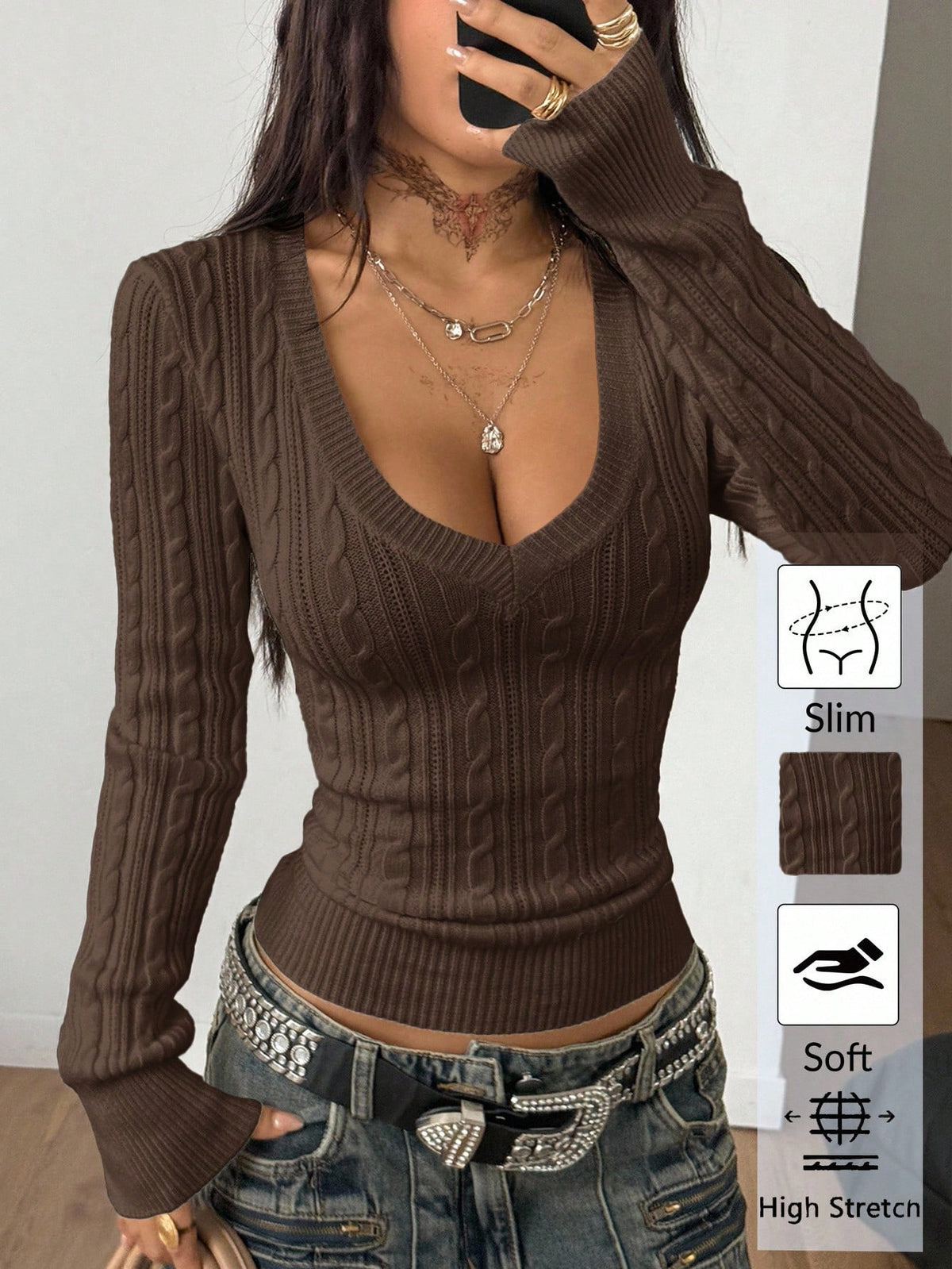 Women's slim fit cable-knit long sleeve sweater featuring a V-neckline and ribbed knit details.