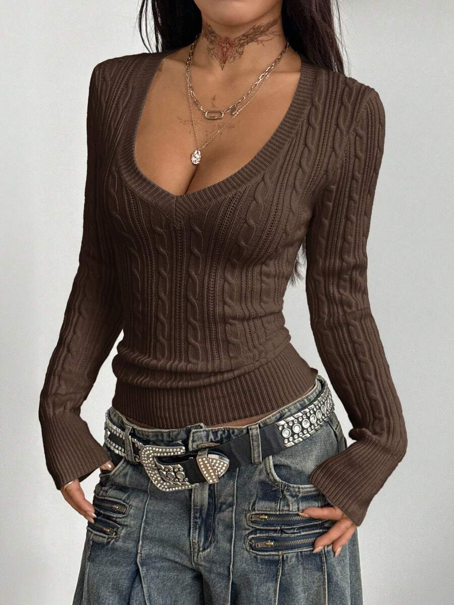 Women's slim fit cable-knit long sleeve sweater featuring a V-neckline and ribbed knit details.