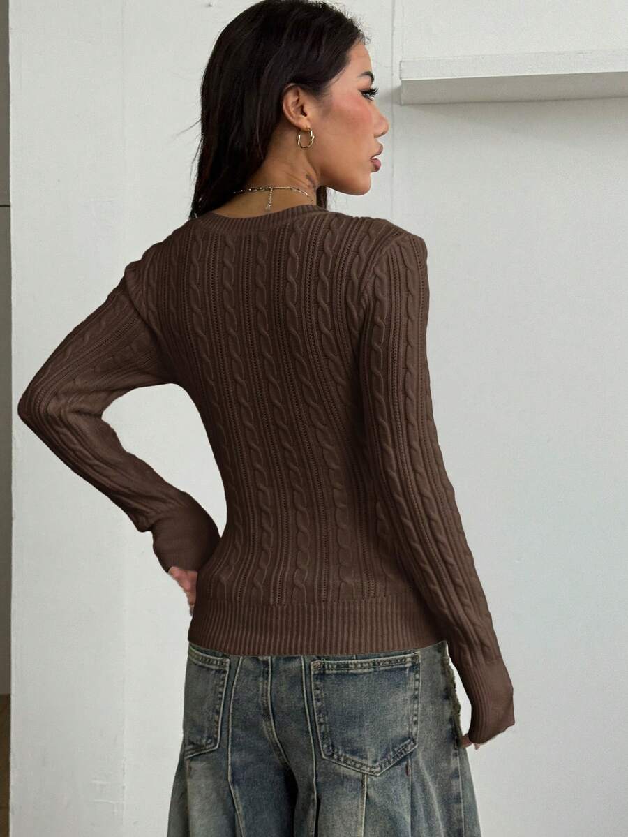 Women's slim fit cable-knit long sleeve sweater featuring a V-neckline and ribbed knit details.