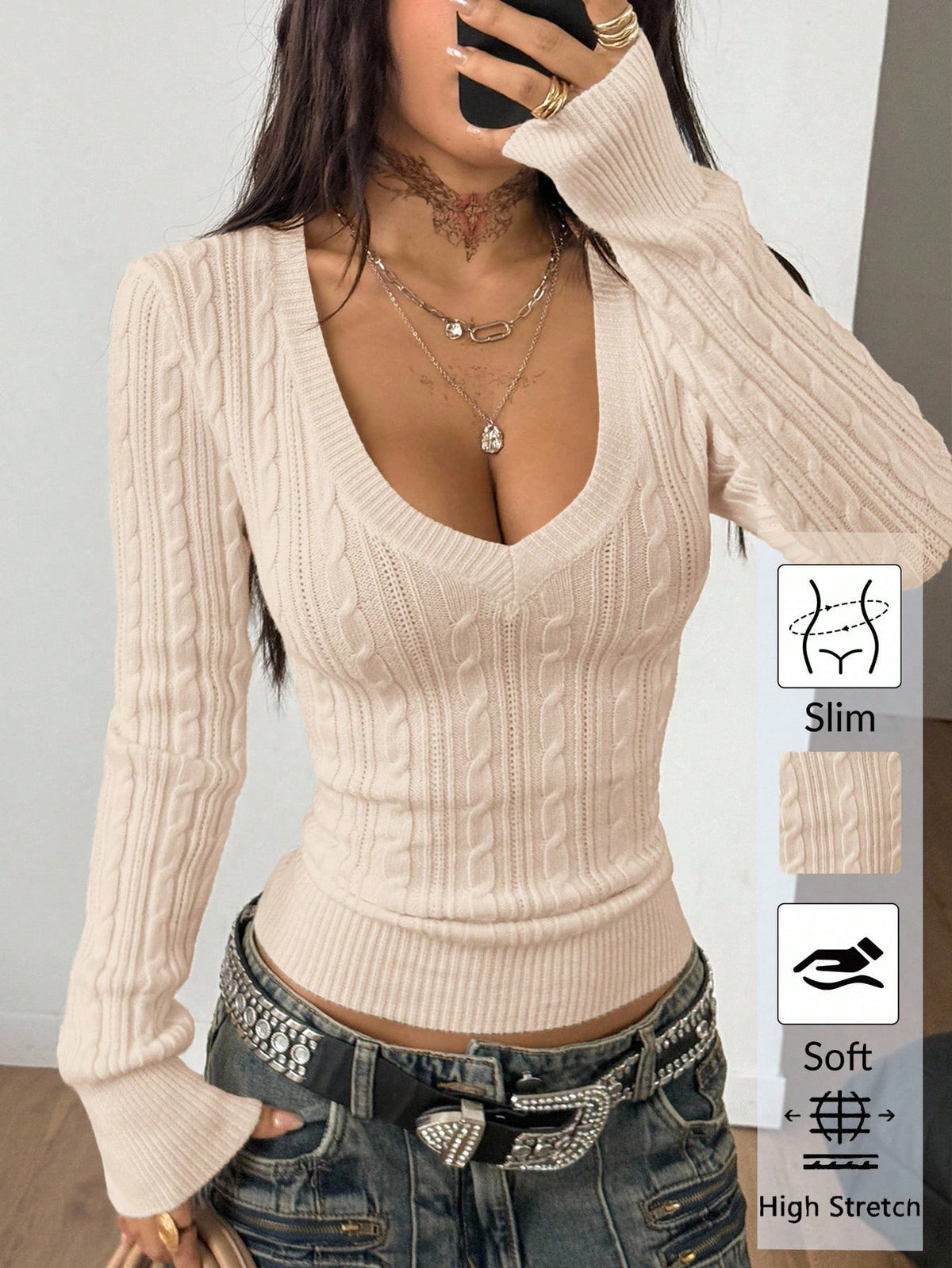 Women's slim fit cable-knit sweater with a V-neckline and long sleeves in solid green rib knit fabric.