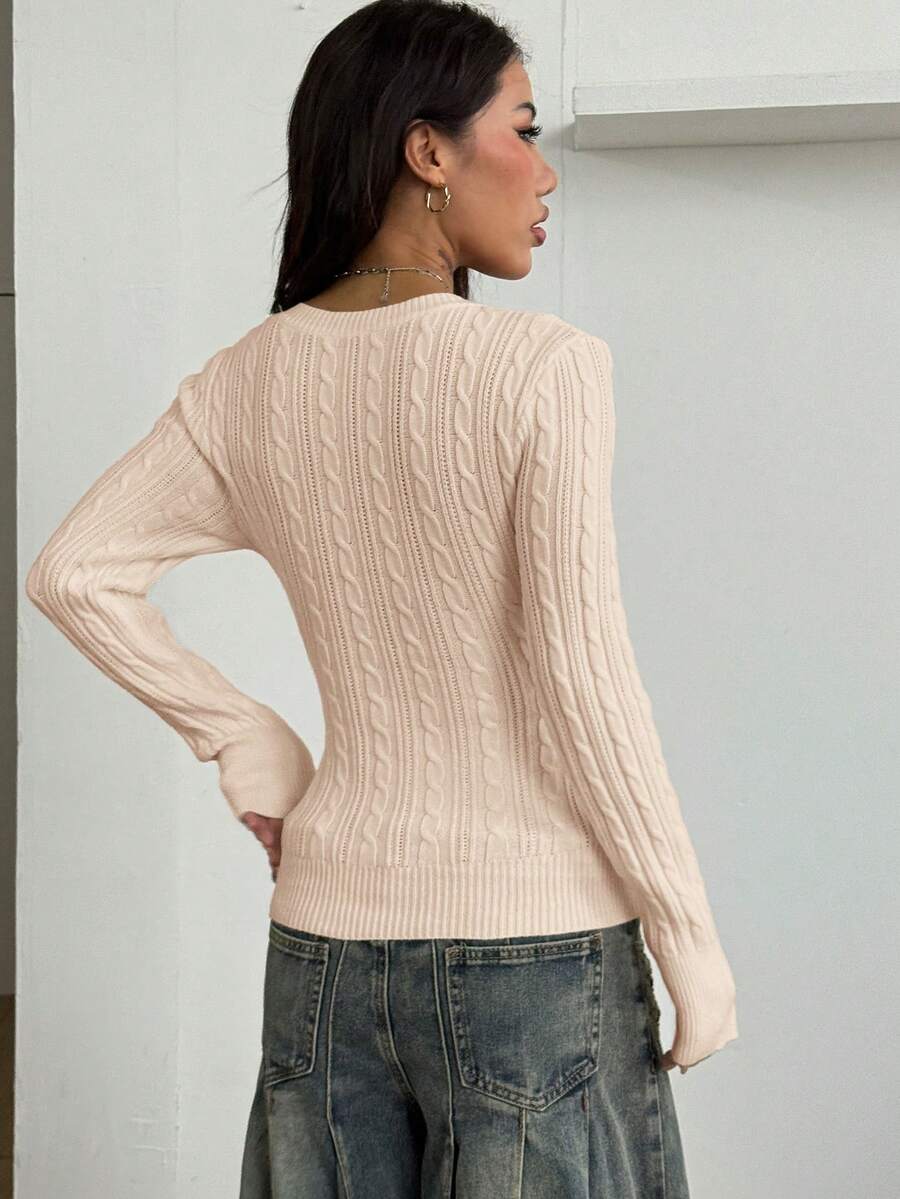 Women's slim fit cable-knit sweater with a V-neckline and long sleeves in solid green rib knit fabric.
