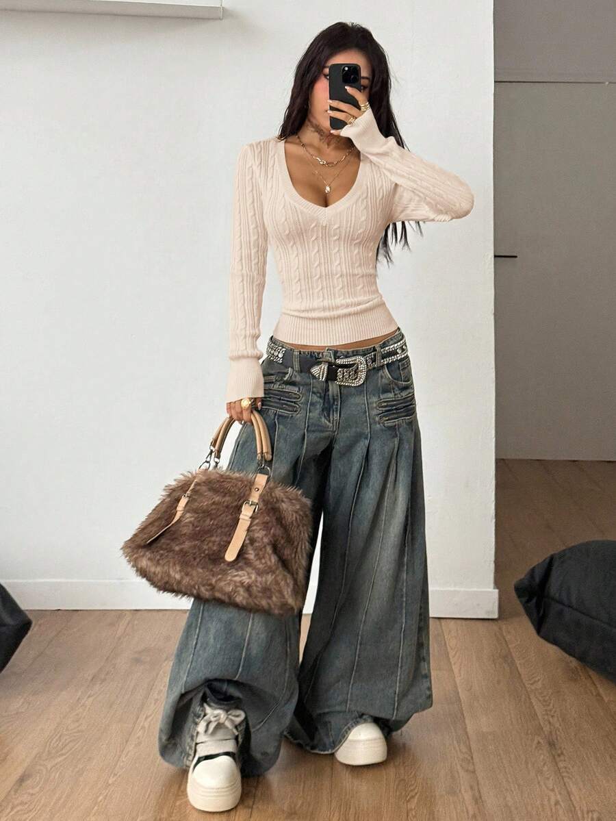 Women's slim fit cable-knit sweater with a V-neckline and long sleeves in solid green rib knit fabric.