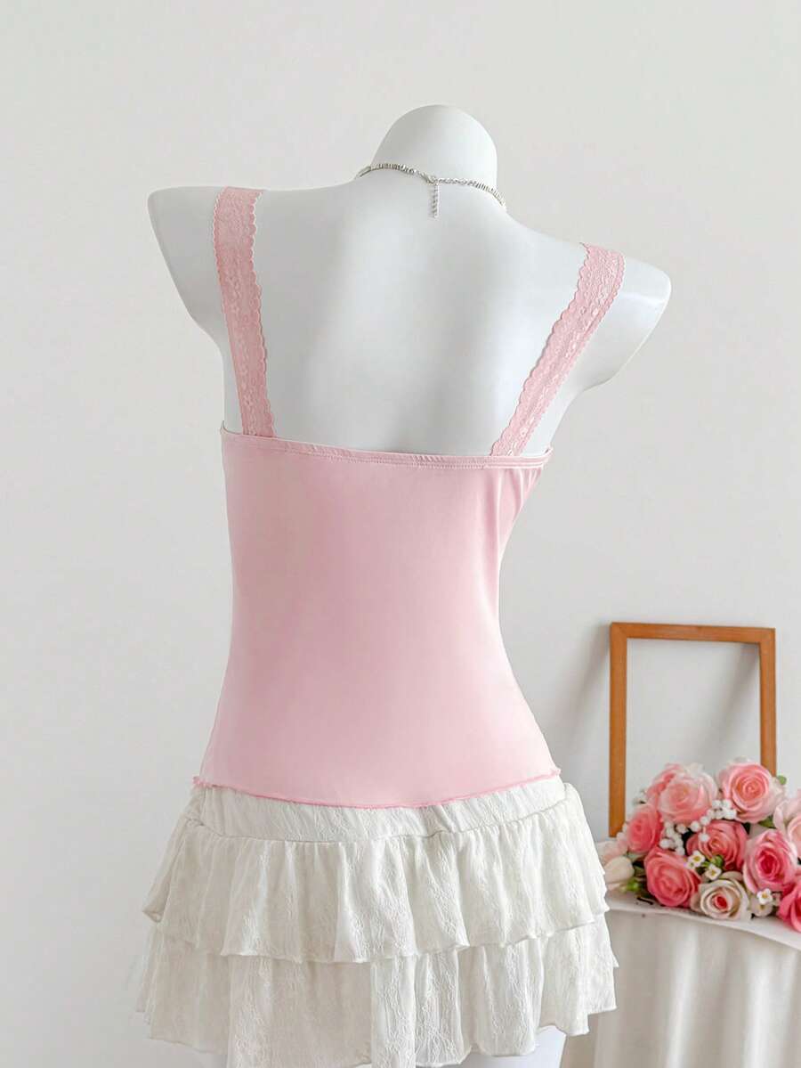 Women's slim fit casual camisole featuring wide shoulder straps, contrast lace trim, a front knot, and ruched details.