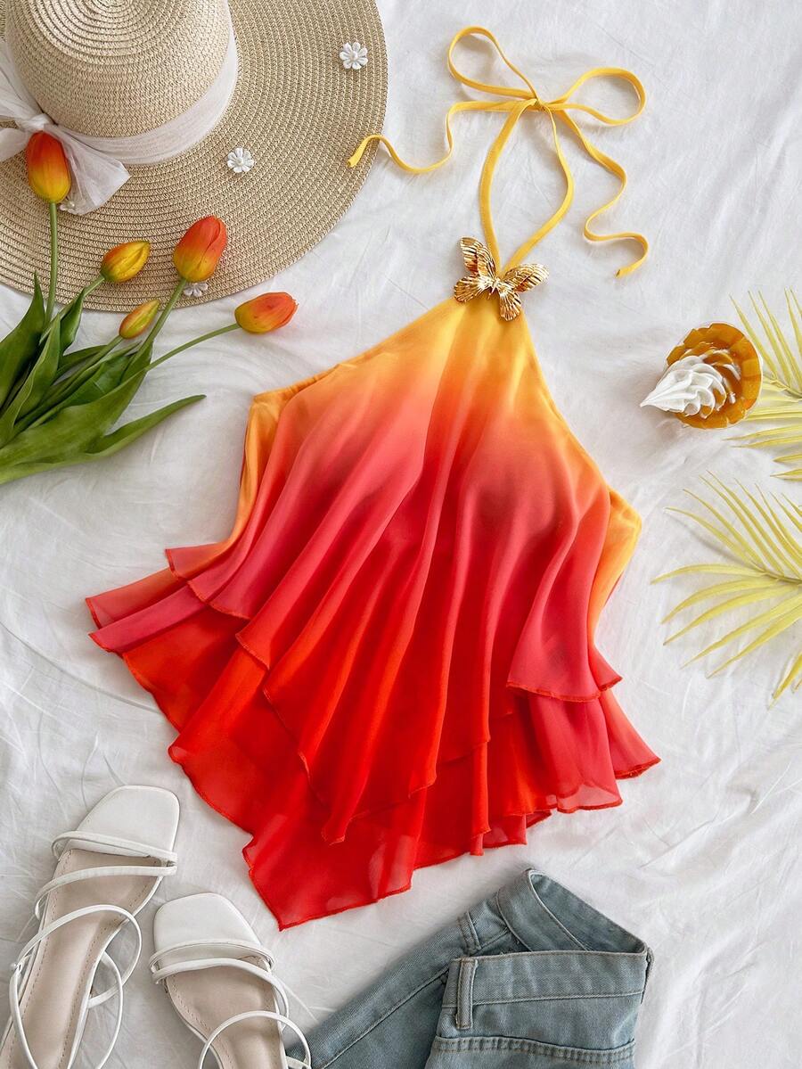 Women's gradient halter top with draped neck, butterfly metal accent, backless cut, and asymmetrical hem