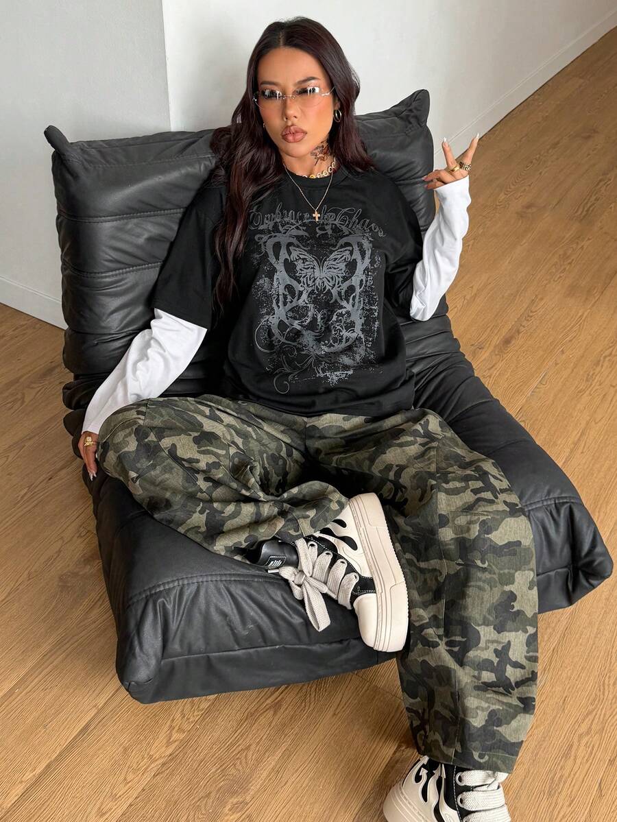 Women's casual graphic long sleeve t-shirt with a round neck, drop shoulder sleeves, and loose relaxed fit.