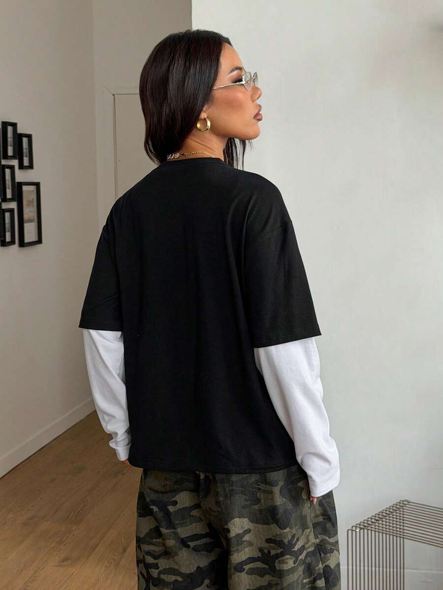 Women's casual graphic long sleeve t-shirt with a round neck, drop shoulder sleeves, and loose relaxed fit.