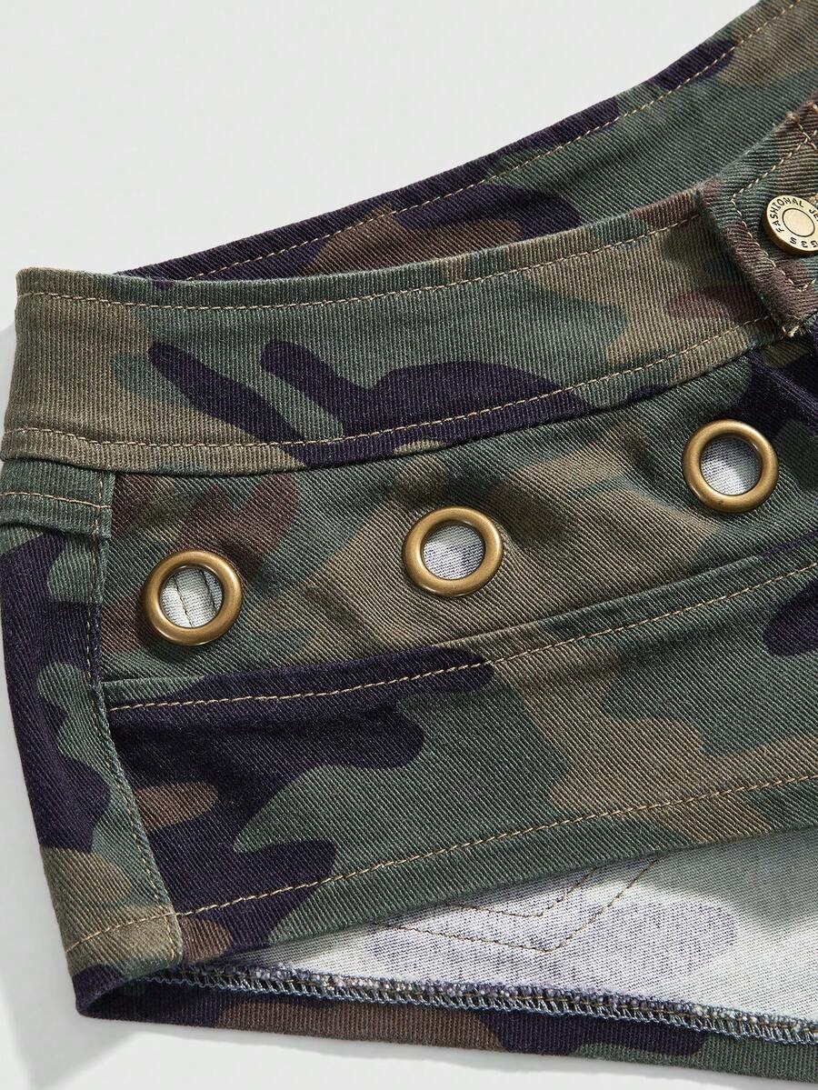 Women's ultra low waist camouflage mini skort shorts with zipper fly, button detail, and grommet eyelet accents.
