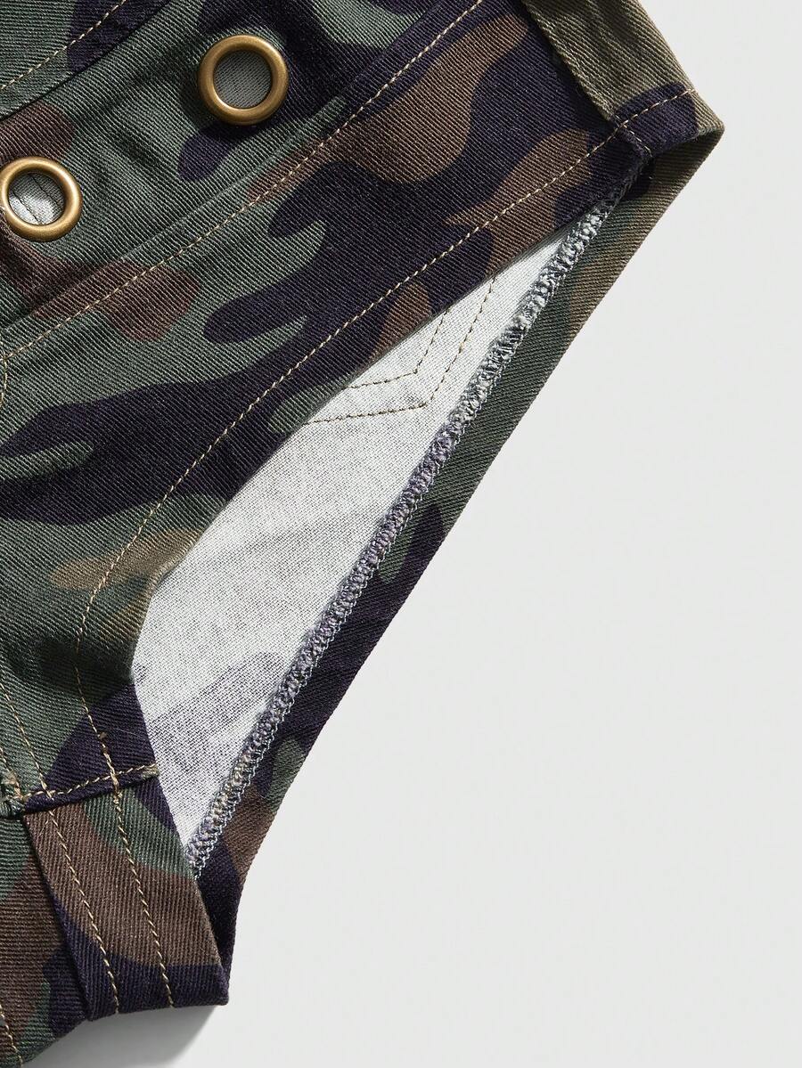 Women's ultra low waist camouflage mini skort shorts with zipper fly, button detail, and grommet eyelet accents.