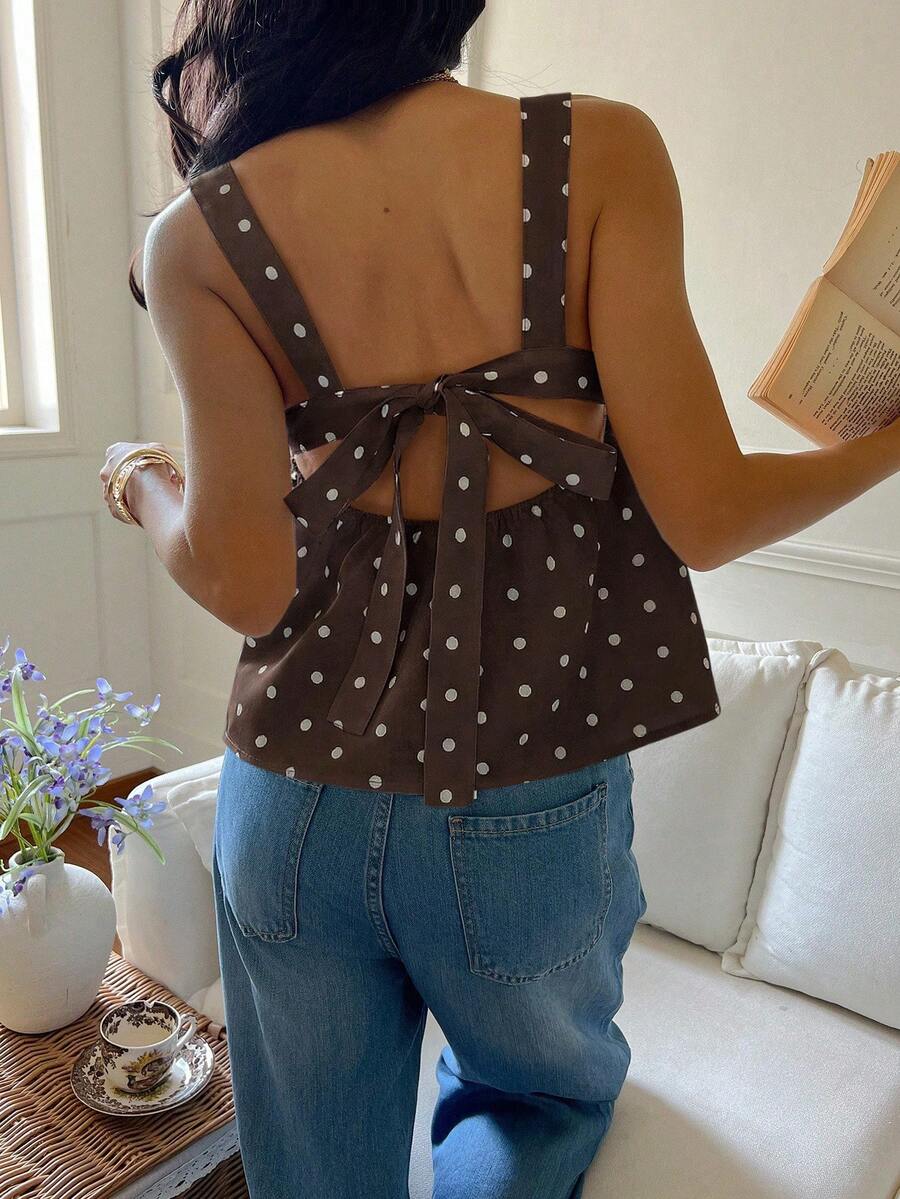 Women's casual polka dot tank top with tie-front knot, strap neckline, backless design, and ruffle flared hem