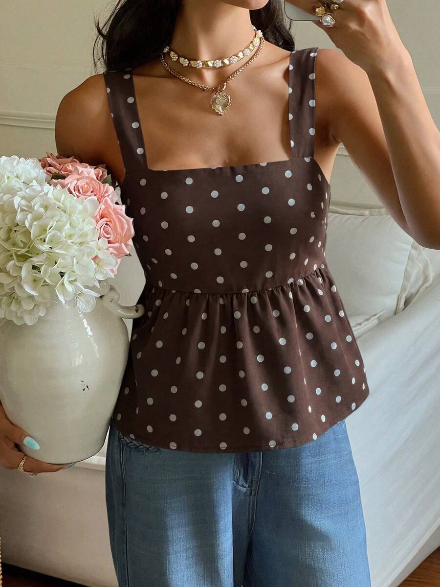Women's casual polka dot tank top with tie-front knot, strap neckline, backless design, and ruffle flared hem