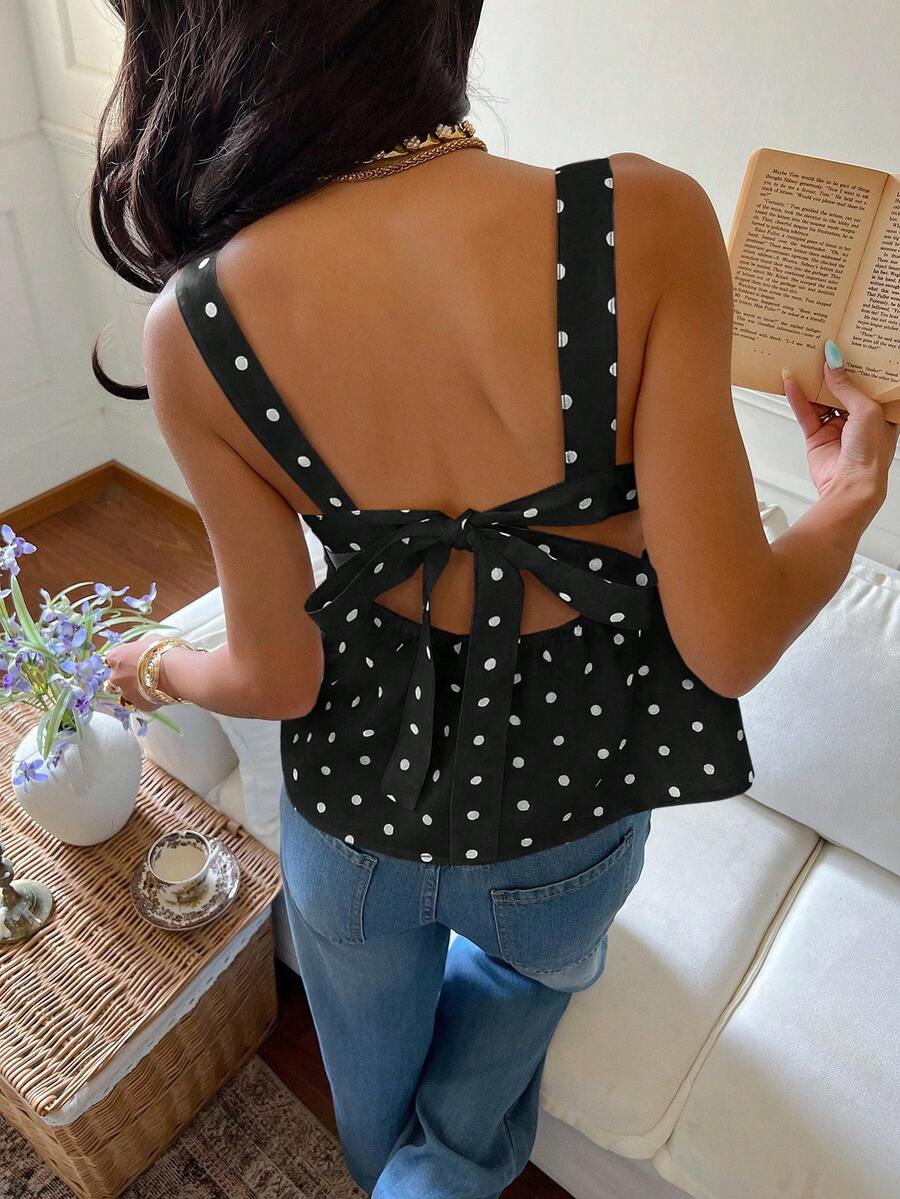 Women's casual polka dot tank top with tie-front knot, strap neckline, backless design, and ruffle flared hem