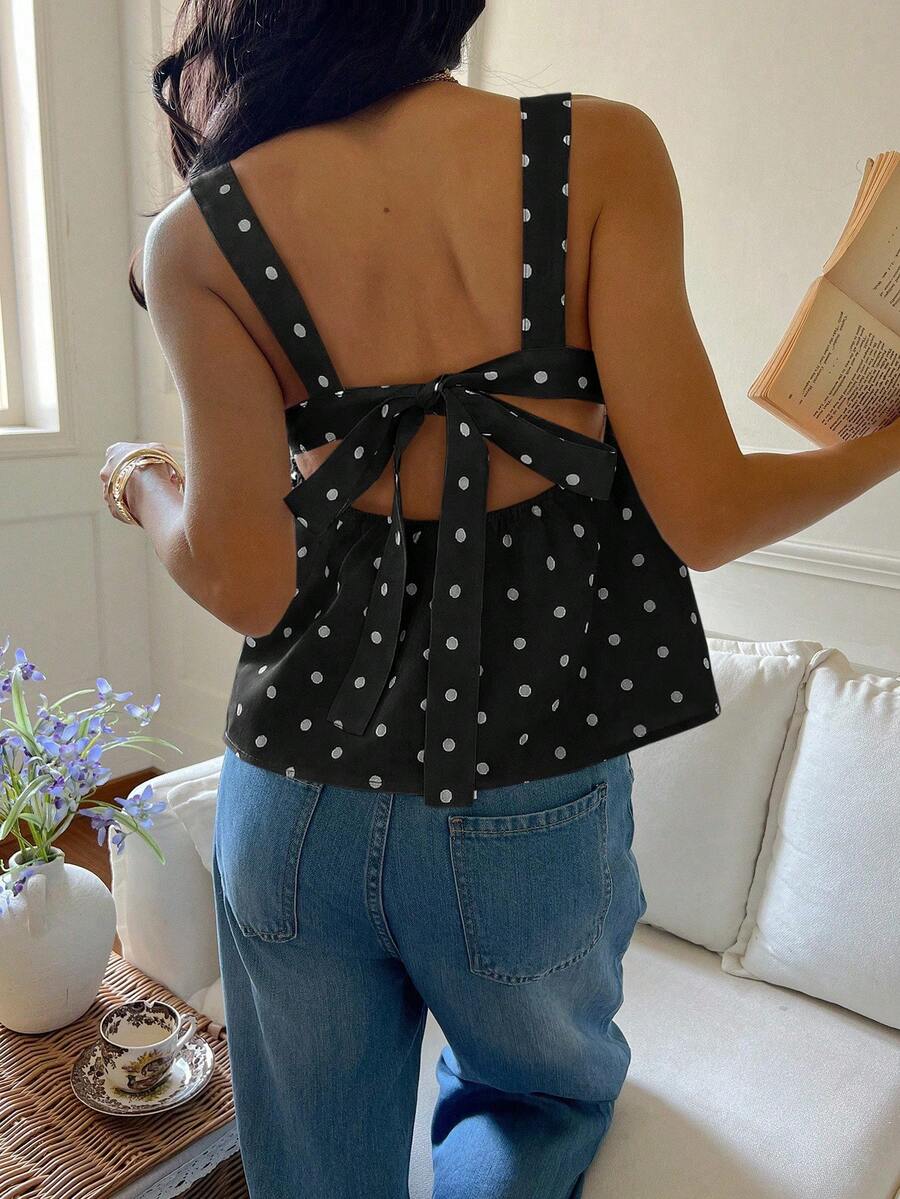 Women's casual polka dot tank top with tie-front knot, strap neckline, backless design, and ruffle flared hem