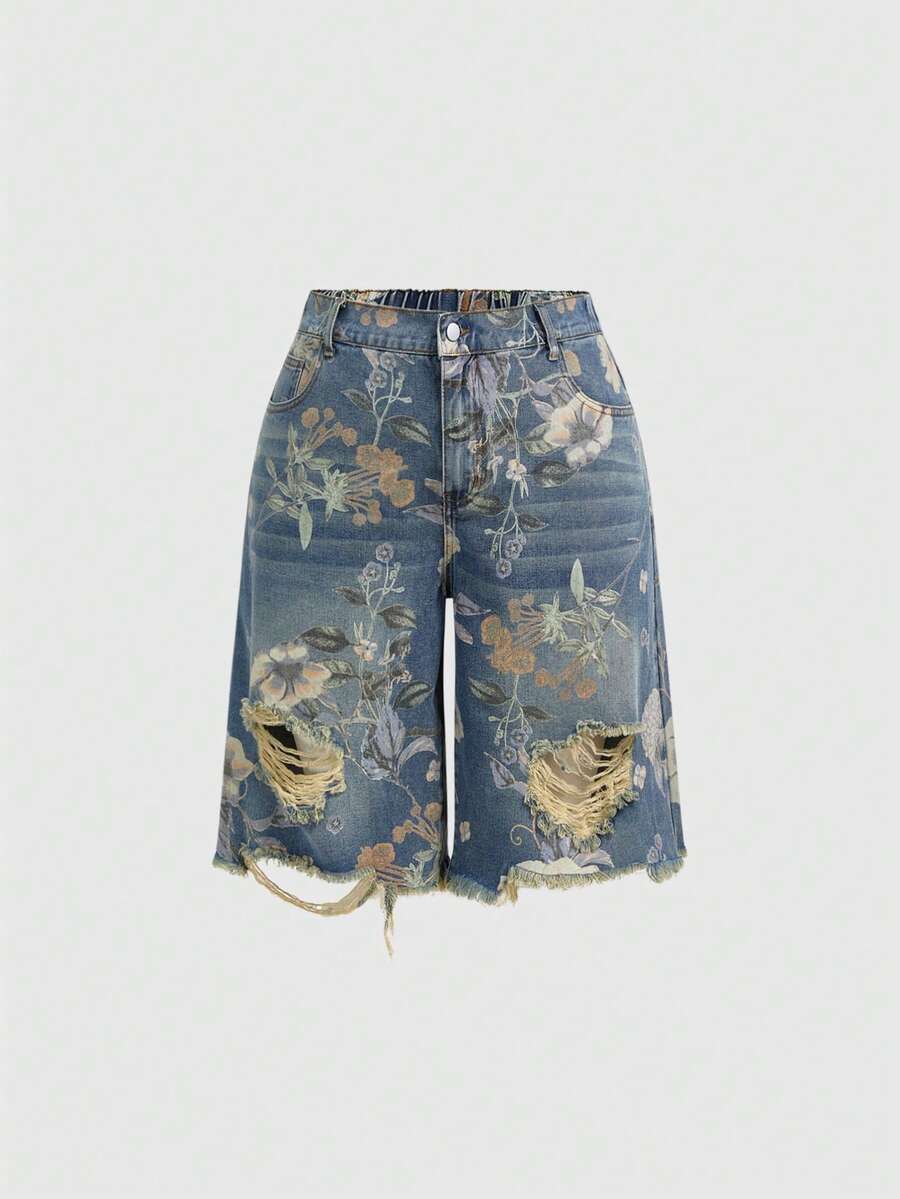 Women's loose wide-leg denim Bermuda shorts featuring vintage animal and paisley print with pockets and zipper fly.