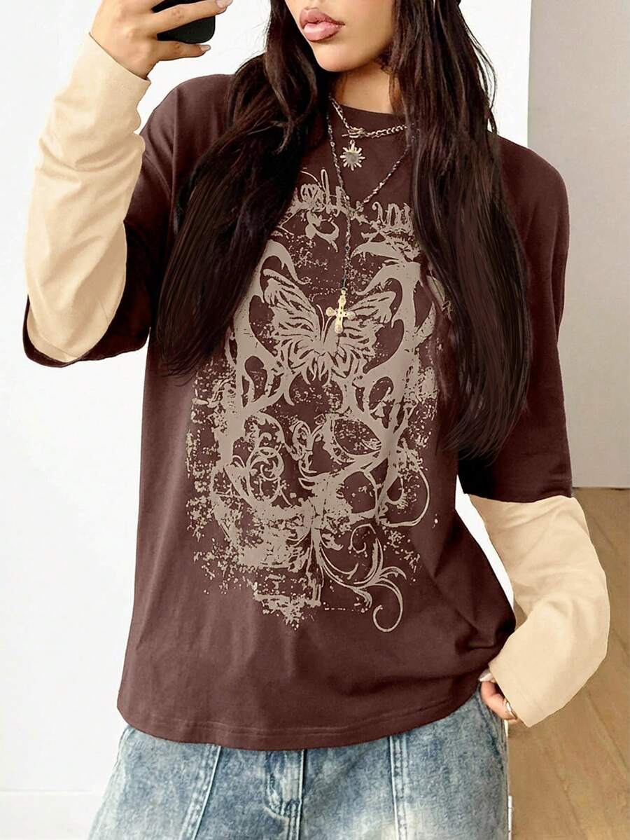 Women's casual graphic long sleeve t-shirt with a round neck, drop shoulder sleeves, and loose relaxed fit.