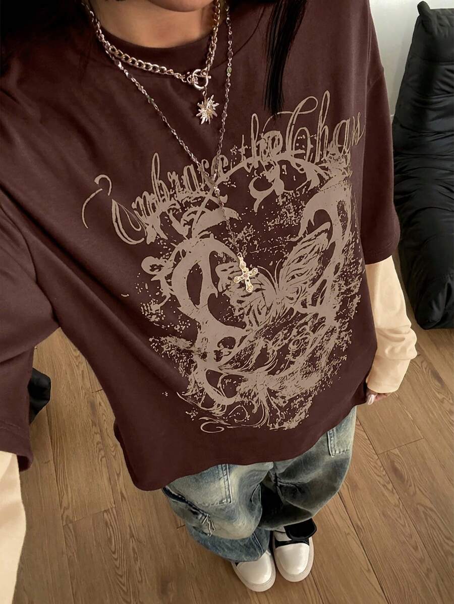Women's casual graphic long sleeve t-shirt with a round neck, drop shoulder sleeves, and loose relaxed fit.