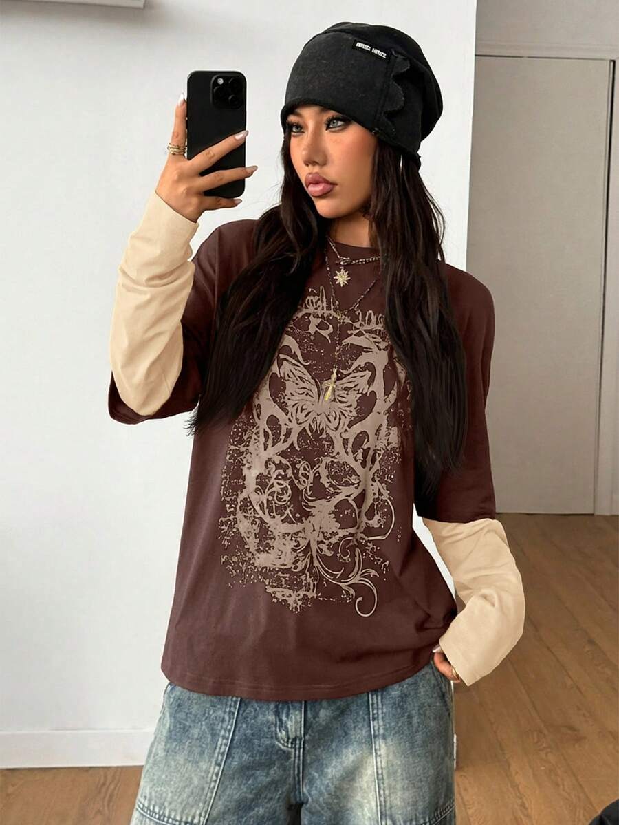 Women's casual graphic long sleeve t-shirt with a round neck, drop shoulder sleeves, and loose relaxed fit.
