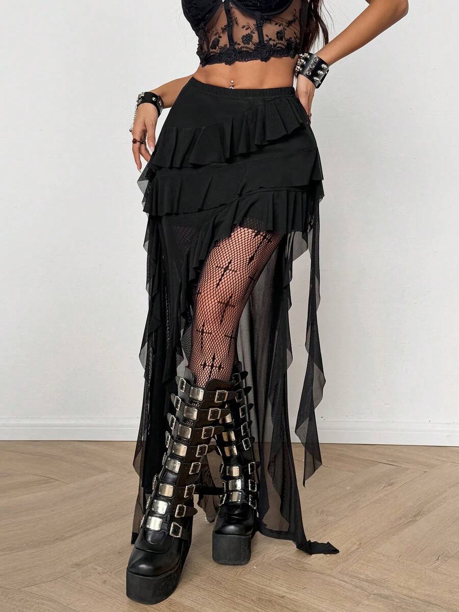 Women's low rise asymmetrical long skirt with ruffle hem detailing in semi-sheer knitted fabric.