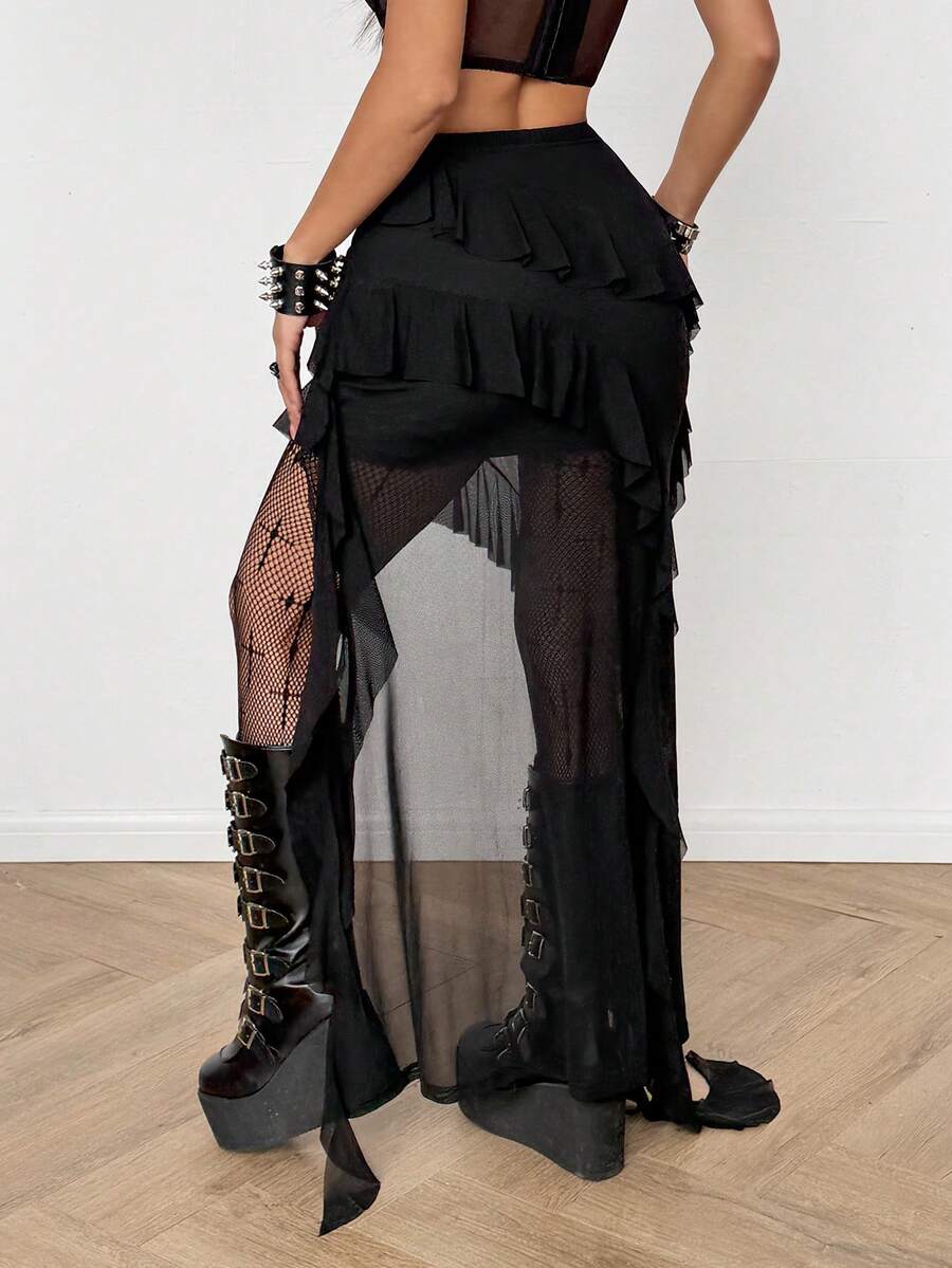 Women's low rise asymmetrical long skirt with ruffle hem detailing in semi-sheer knitted fabric.