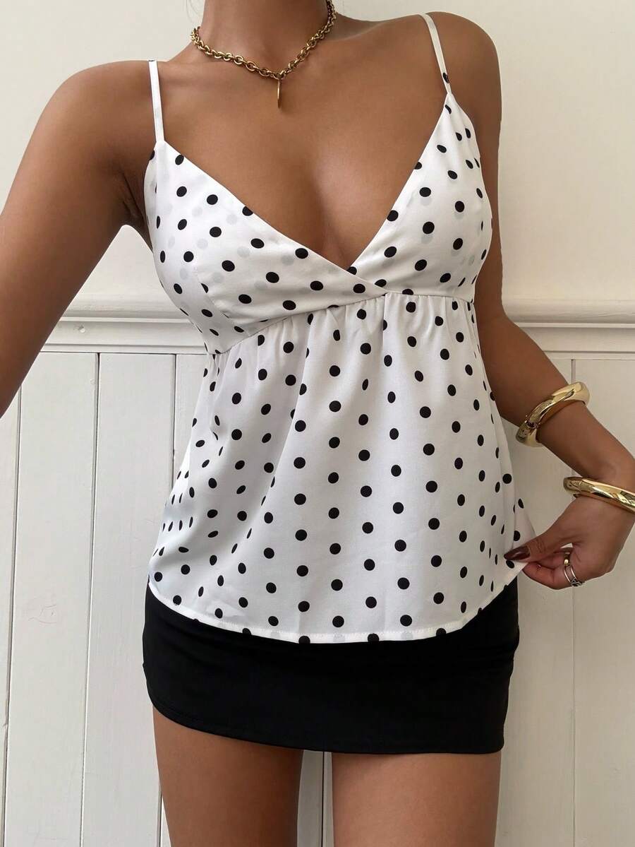 Women's casual geometric cami top with spaghetti straps, backless wrap styling, button front, and asymmetrical hem.