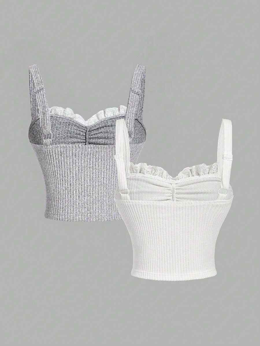 Black crop camisole top for women featuring shoulder straps, cold shoulder sleeves, drawstring detail, and frill trim on plain knitted fabric.