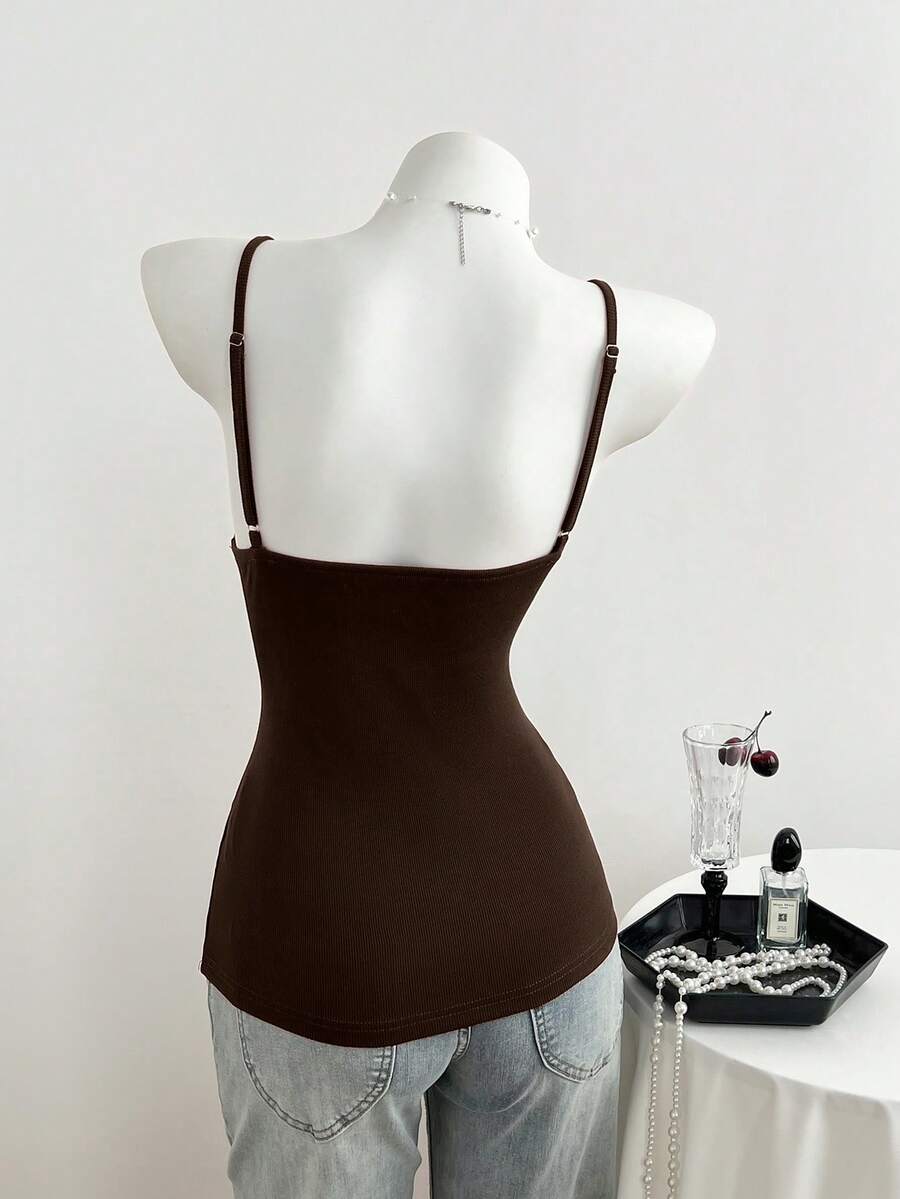 Women's slim fit backless cami tank top with contrast lace patchwork details, spaghetti straps, and high-stretch knitted ribbed fabric.