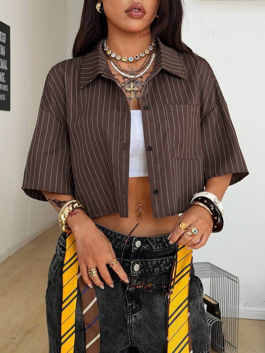 Women's plaid crop shirt with button front, chest pocket, short sleeves, and loose casual fit.
