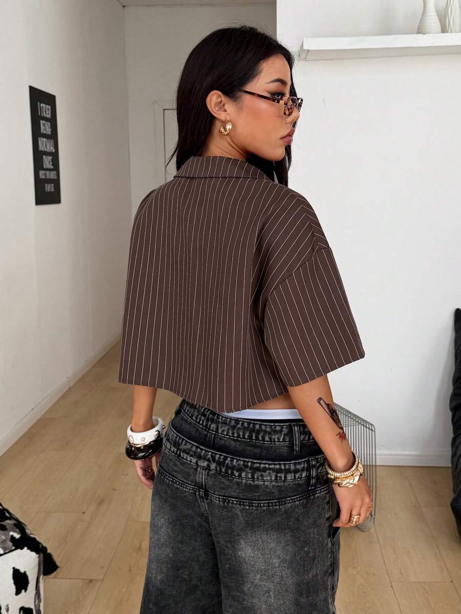 Women's plaid crop shirt with button front, chest pocket, short sleeves, and loose casual fit.