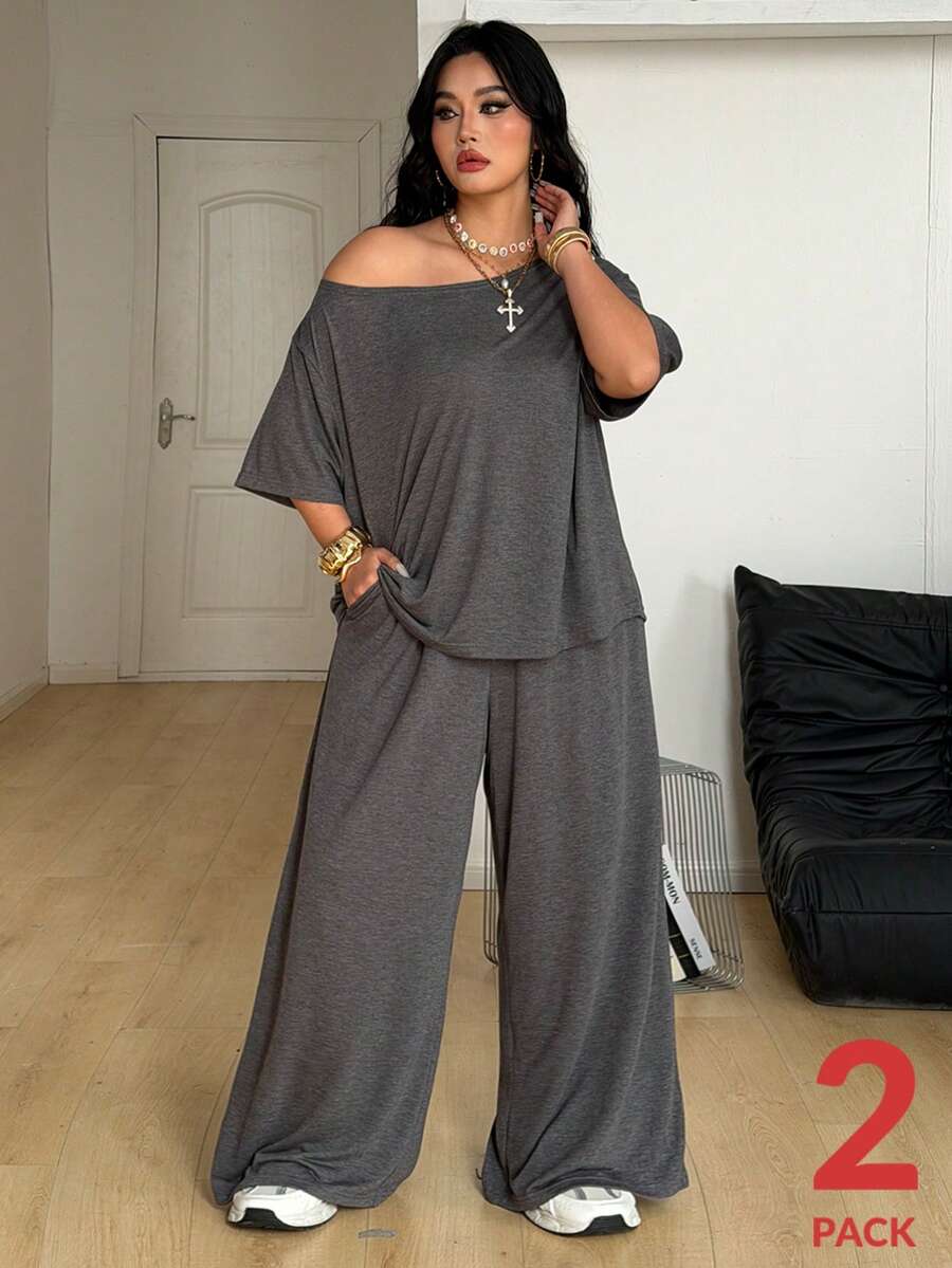 Women's casual two-piece outfit featuring a loose short-sleeve asymmetrical neck t-shirt and matching long wide leg pants with pockets.