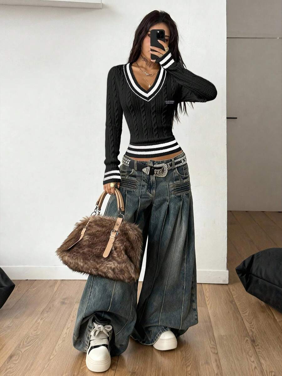 Women's slim fit cable-knit sweater with a V-neckline and long sleeves in solid green rib knit fabric.
