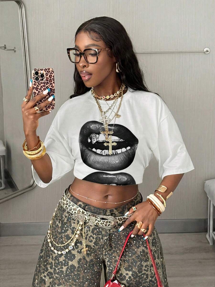 Women's oversized graphic crew neck t-shirt made of 100% white cotton knitted fabric with drop shoulder half sleeves.