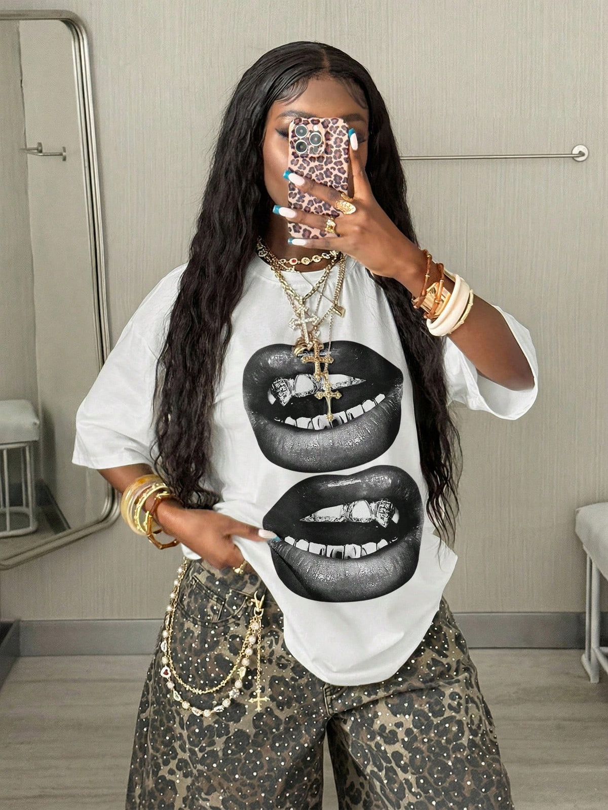 Women's oversized graphic crew neck t-shirt made of 100% white cotton knitted fabric with drop shoulder half sleeves.