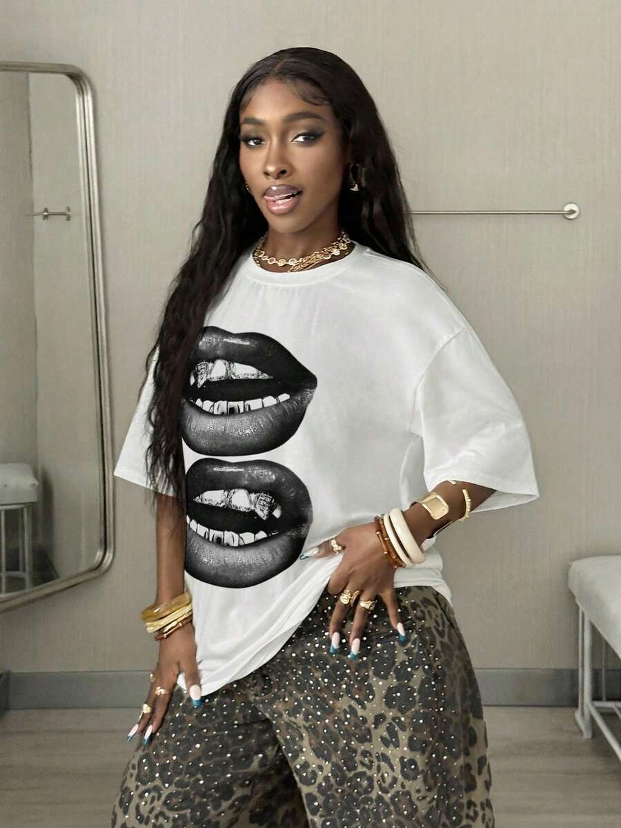 Women's oversized graphic crew neck t-shirt made of 100% white cotton knitted fabric with drop shoulder half sleeves.