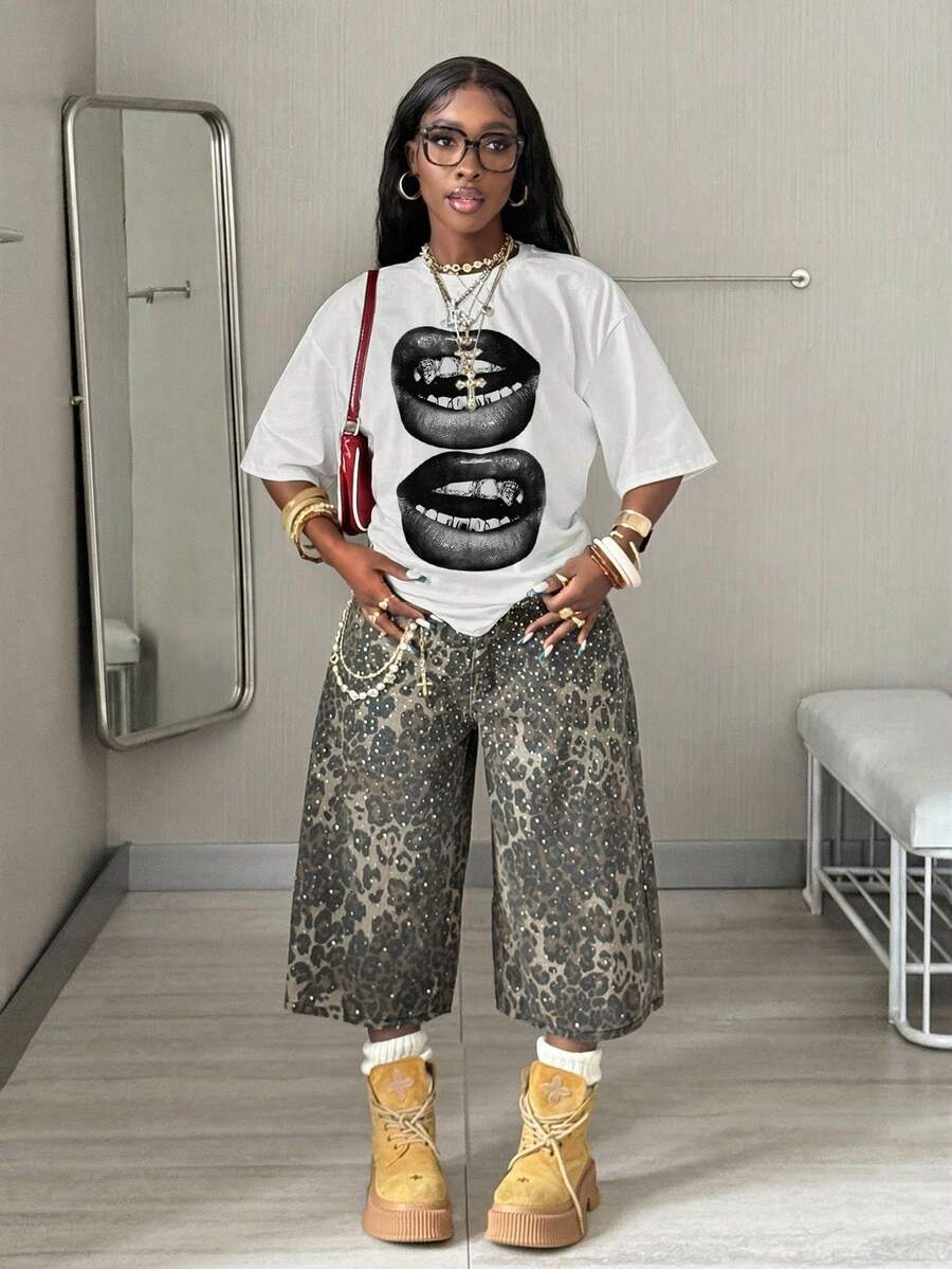 Women's oversized graphic crew neck t-shirt made of 100% white cotton knitted fabric with drop shoulder half sleeves.