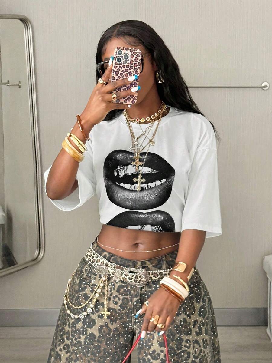 Women's oversized graphic crew neck t-shirt made of 100% white cotton knitted fabric with drop shoulder half sleeves.