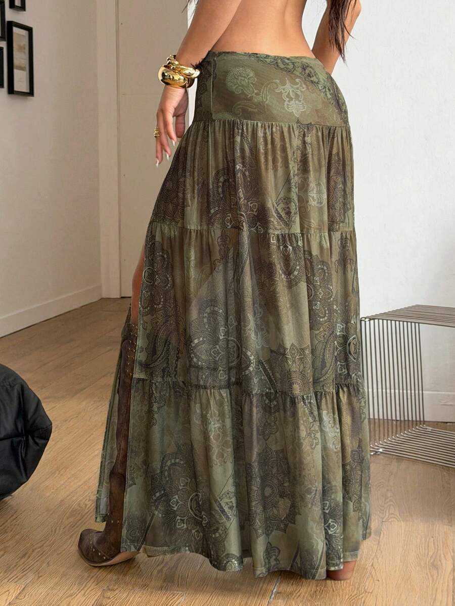 Women's low rise flared long skirt featuring an all-over print, split thigh accent, and textured semi-sheer fabric.