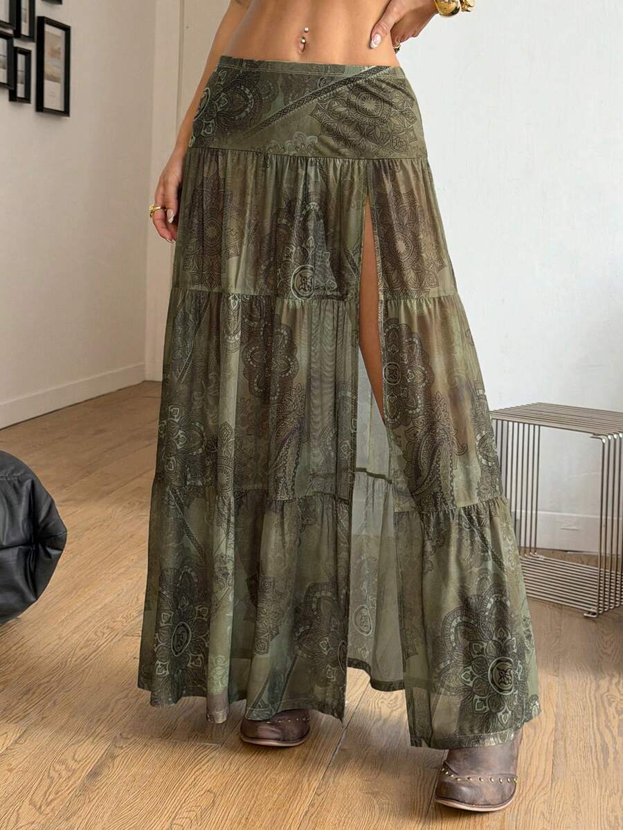Women's low rise flared long skirt featuring an all-over print, split thigh accent, and textured semi-sheer fabric.