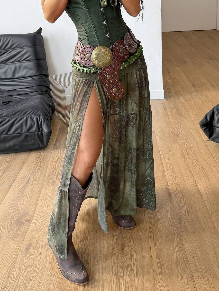Women's low rise flared long skirt featuring an all-over print, split thigh accent, and textured semi-sheer fabric.