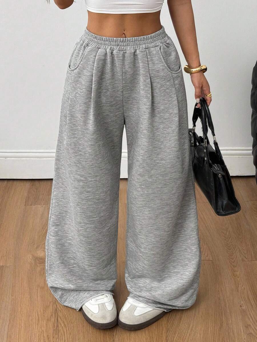 Women's loose wide leg casual sweatpants with an elastic waistband and side pockets
