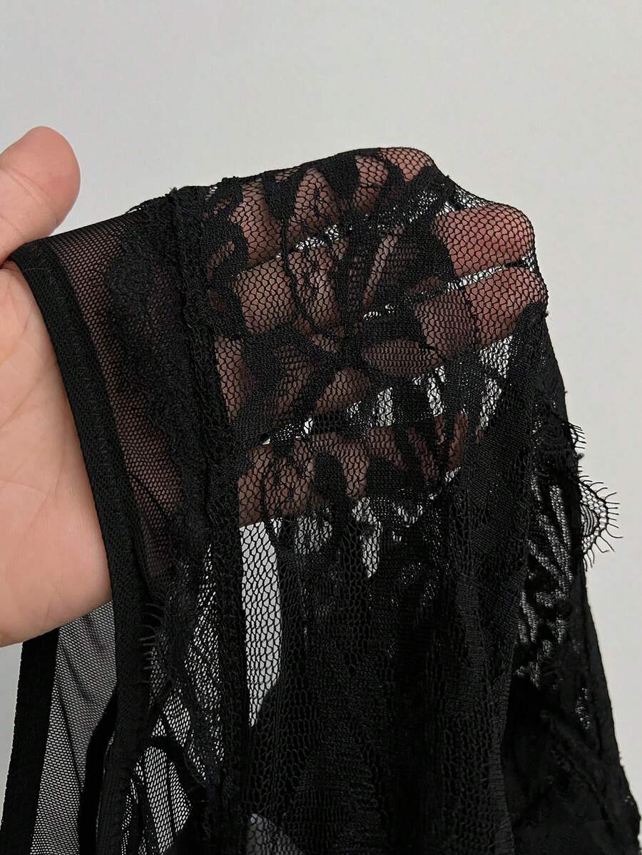 Fitted women's lace and mesh cami bodysuit with spaghetti straps.