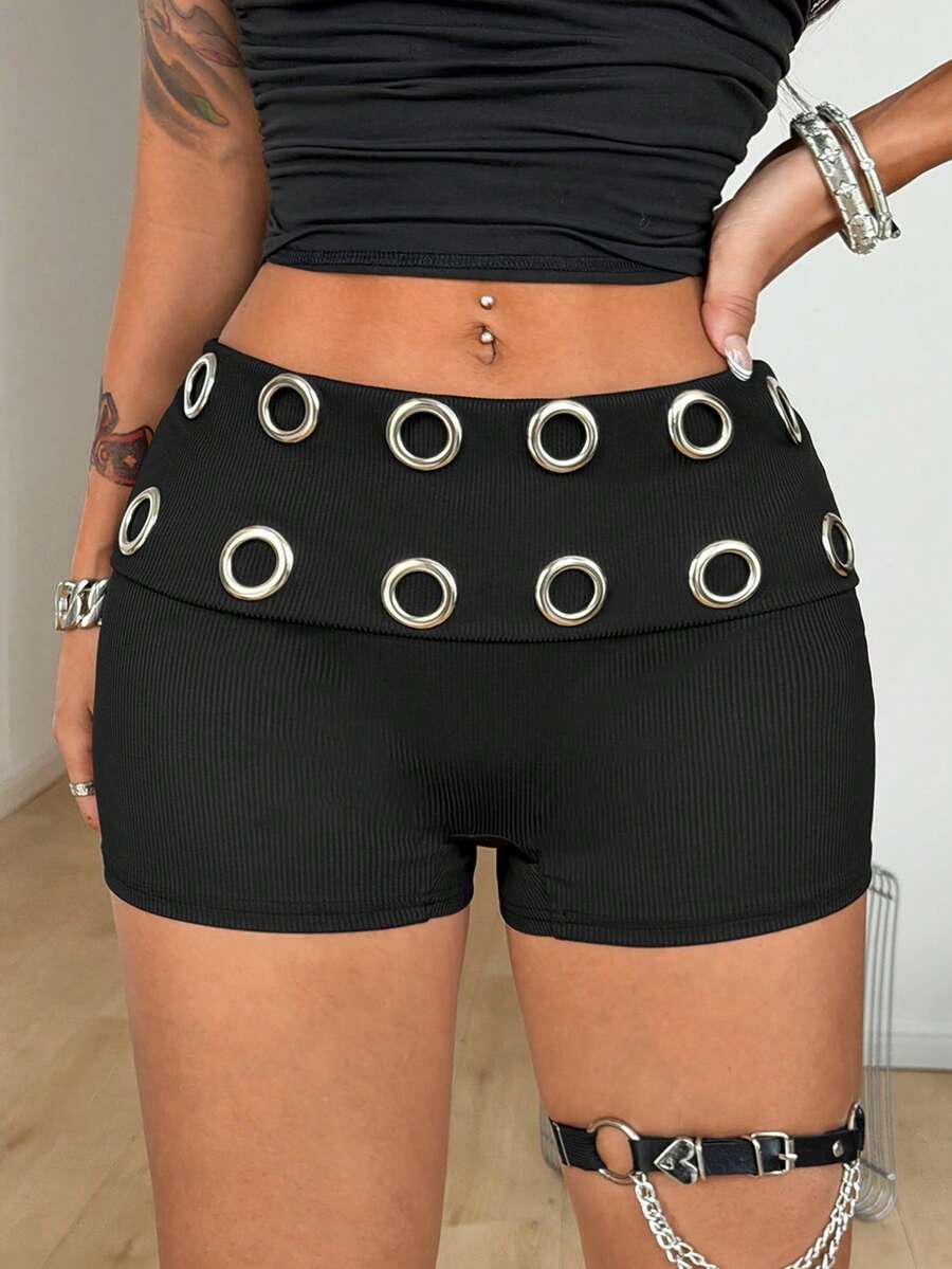 Women's black studded mini shorts crafted from stretch knitted fabric featuring an elastic waistband and skinny fit.