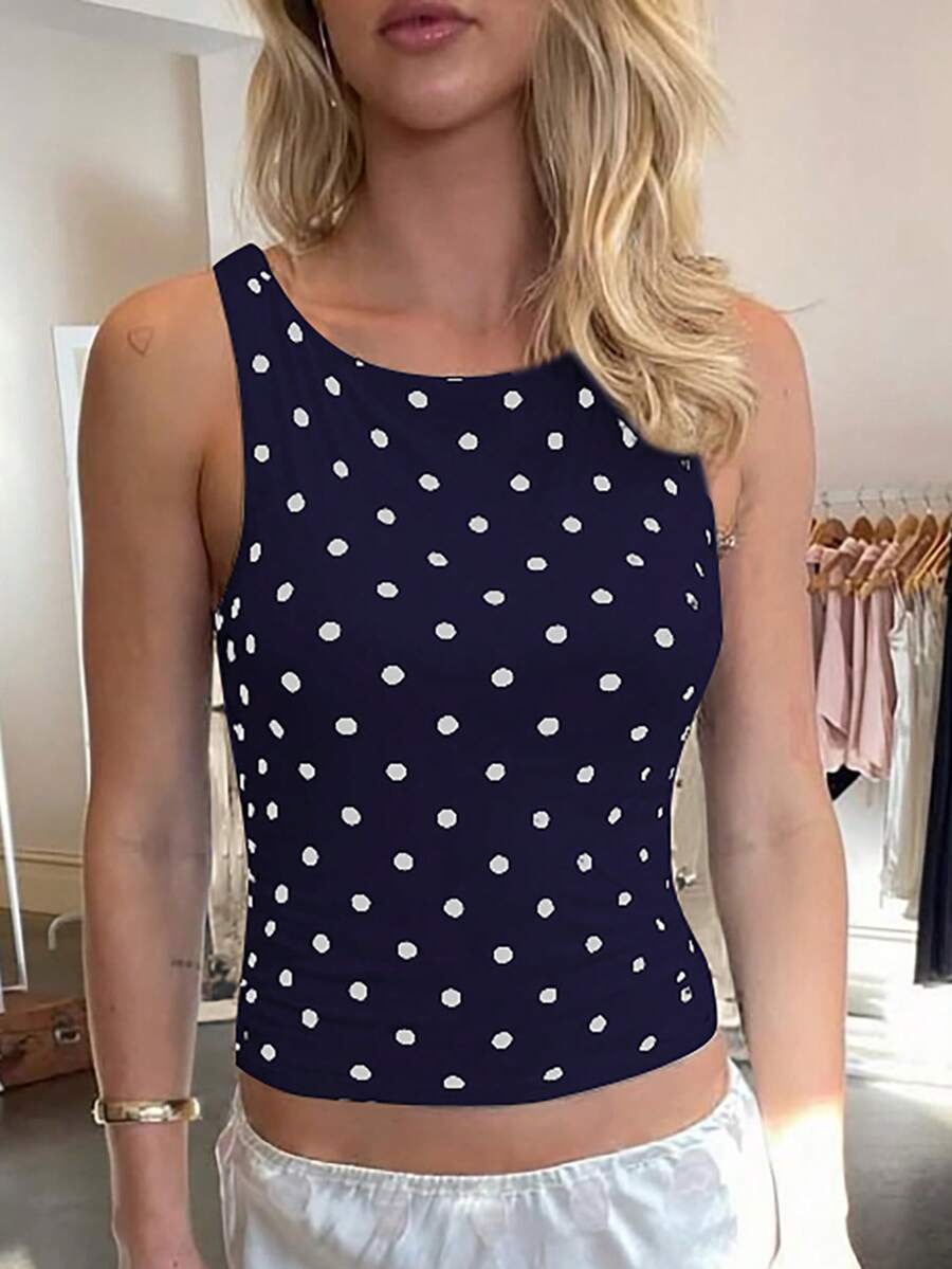 Women's polka dot sleeveless tank top with round neck, ruched rib-knit detail, regular hem, and slim fit casual style